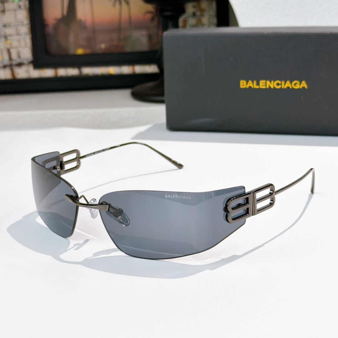 Shield sunglasses with gold frames and blue-gray tinted lenses, side view