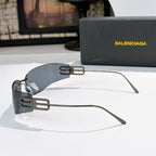 Oversized shield sunglasses with dark frames and blue-gray tinted lenses, side view