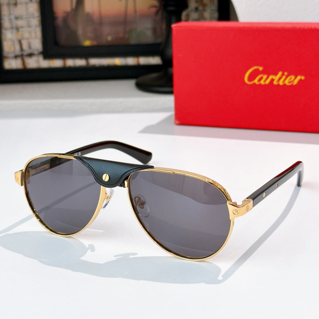 Gold-tone cat-eye sunglasses with gray-blue gradient lenses and dark frames