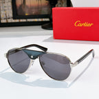 Dark teal cat-eye sunglasses with light gray gradient lenses and gold arms