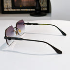 Side-view hexagon sunglasses with black frame and rose tinted lenses
