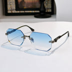 Hexagon sunglasses with gold accents, dark frame, and blue tinted lenses