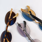 Assorted round chrome glasses with tinted lenses and metal frames, mixed colors