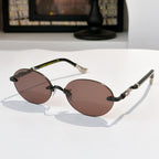 Round chrome glasses with brown tinted lenses and patterned metal temples