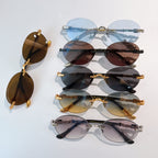 Assorted chrome glasses with round tinted lenses in multiple colors and metal frames