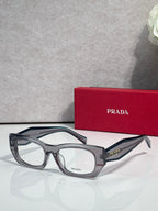 Prada eyeglasses with smoky gray rectangular frame and clear lenses