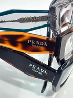 Prada eyeglasses with teal frame and tortoiseshell temple tips