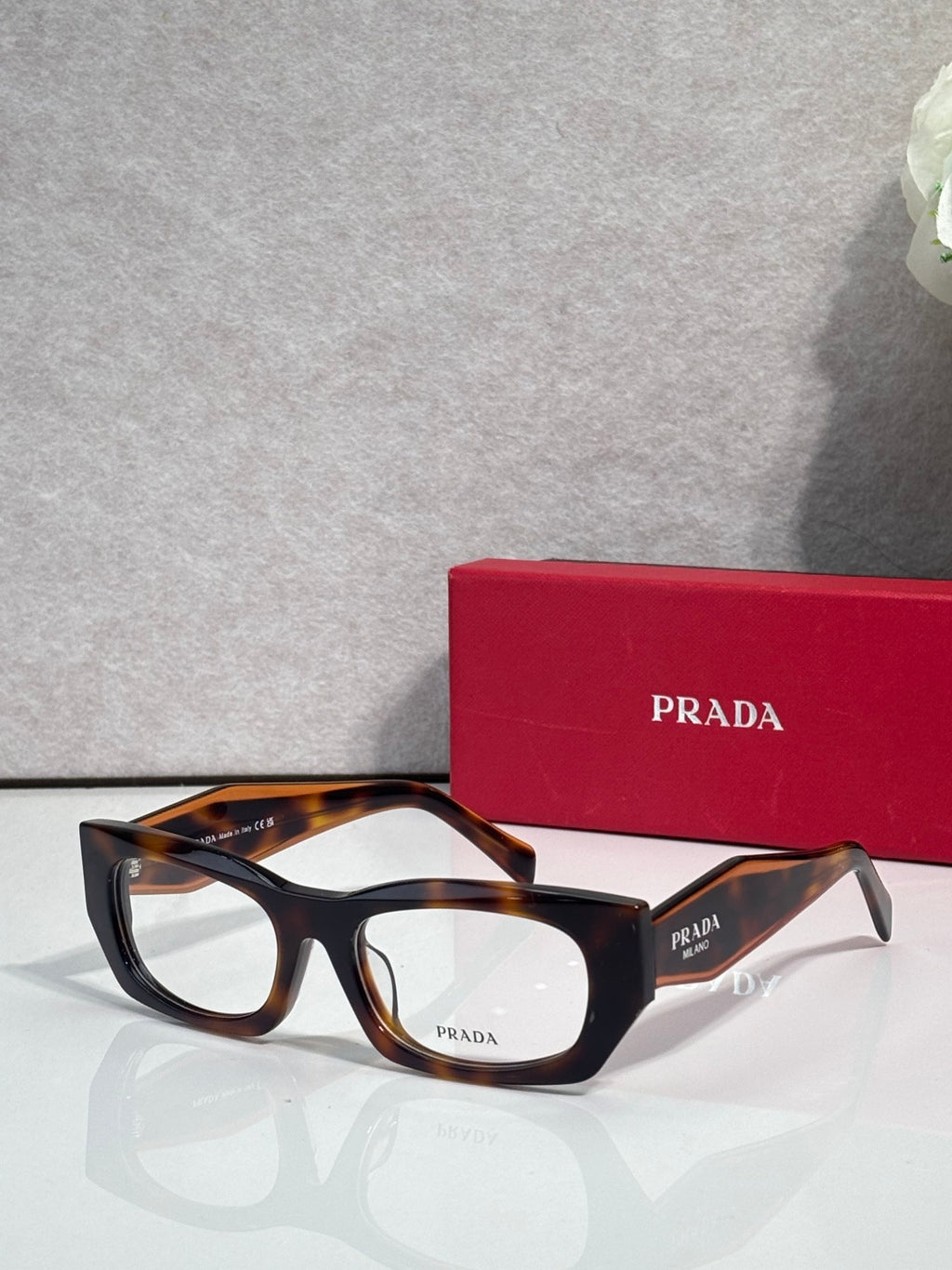 Prada eyeglasses with black frame and tortoiseshell temples
