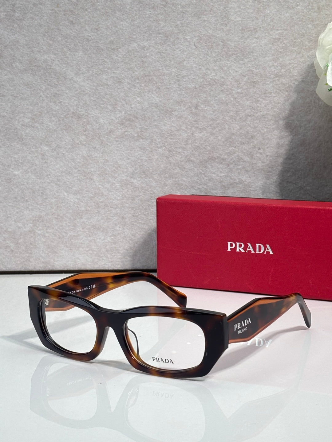 Prada eyeglasses with black frame and tortoiseshell temples