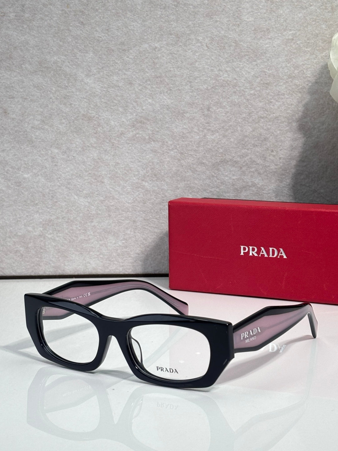 Prada eyeglasses with black frame and clear lenses