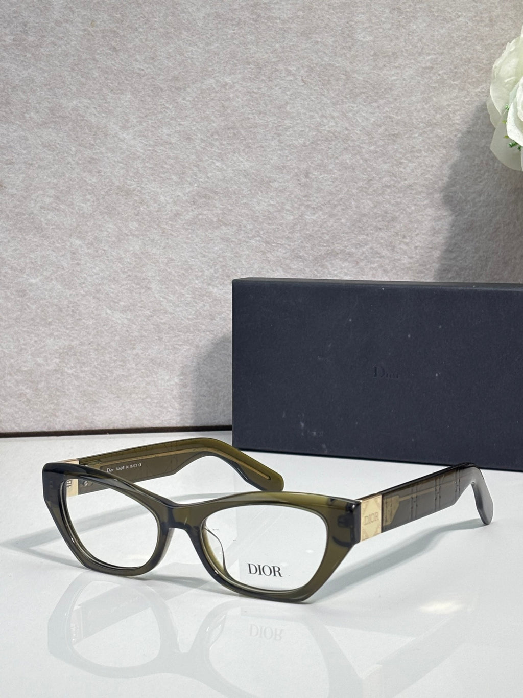Dior eyeglass frames with olive acetate, oval-cut clear lenses, Dior temple logo