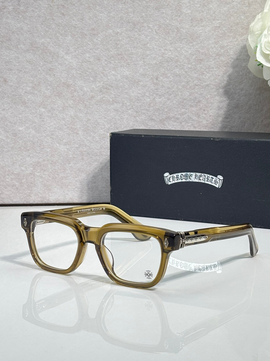 Chrome glasses with gold frames and clear lenses, metallic gold temple details