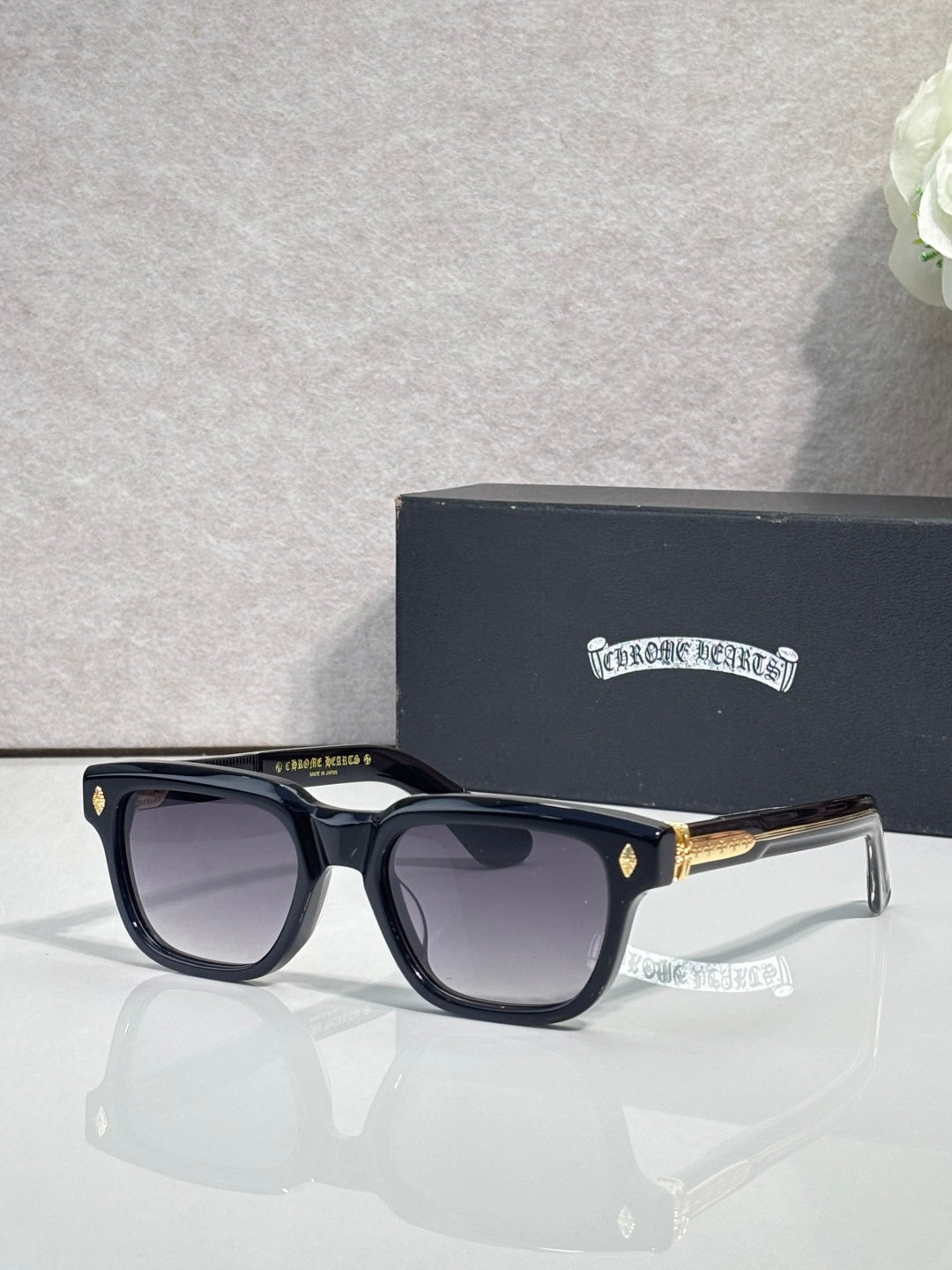 Black sunglasses with dark lenses and clear-accent temples