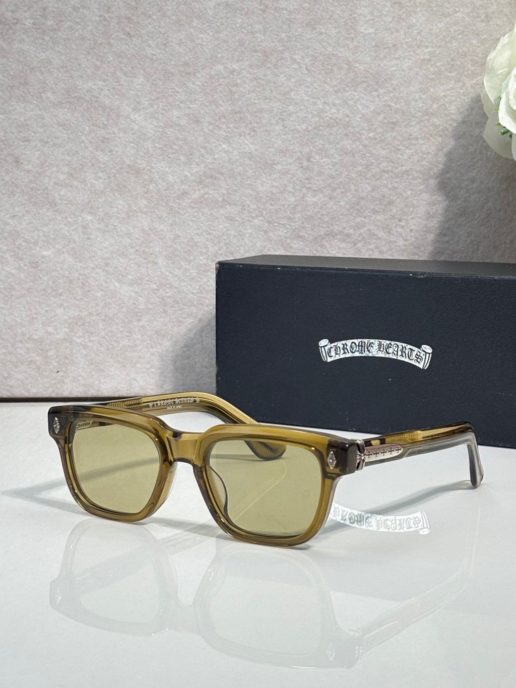 Gold sunglasses with amber lenses and clear temple tips