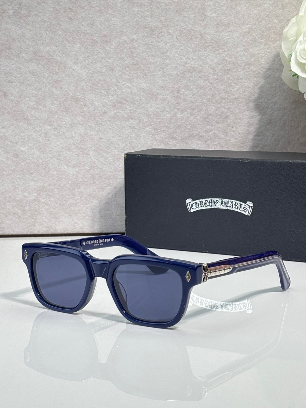 Blue sunglasses with dark lenses and clear-accent temples