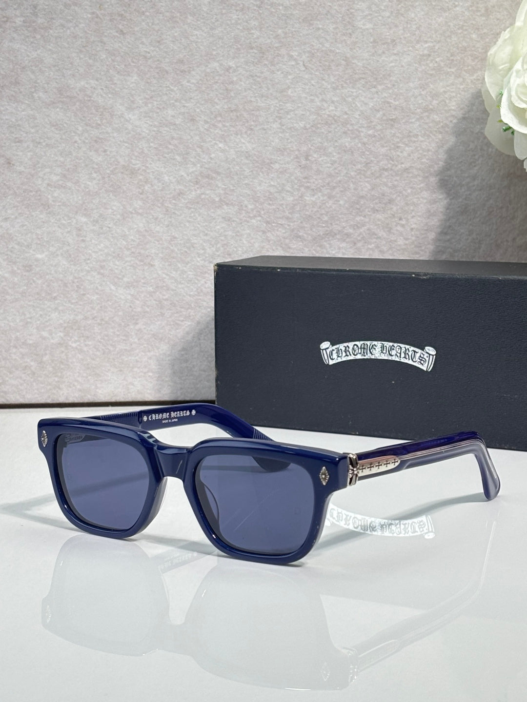 Blue sunglasses with dark lenses and clear-accent temples