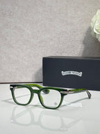 Green round eyeglasses with clear lenses and slim metal arms