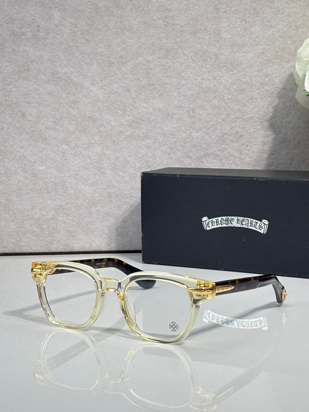 Gold round eyeglasses with clear lenses and slim metal arms