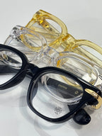 Round eyeglasses assortment in black, gold, and clear frames with floral inlays