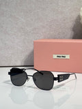 Round sunglasses with black lenses and silver metal frames