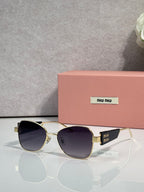 Round sunglasses with dark lenses and gold-tone metal frames