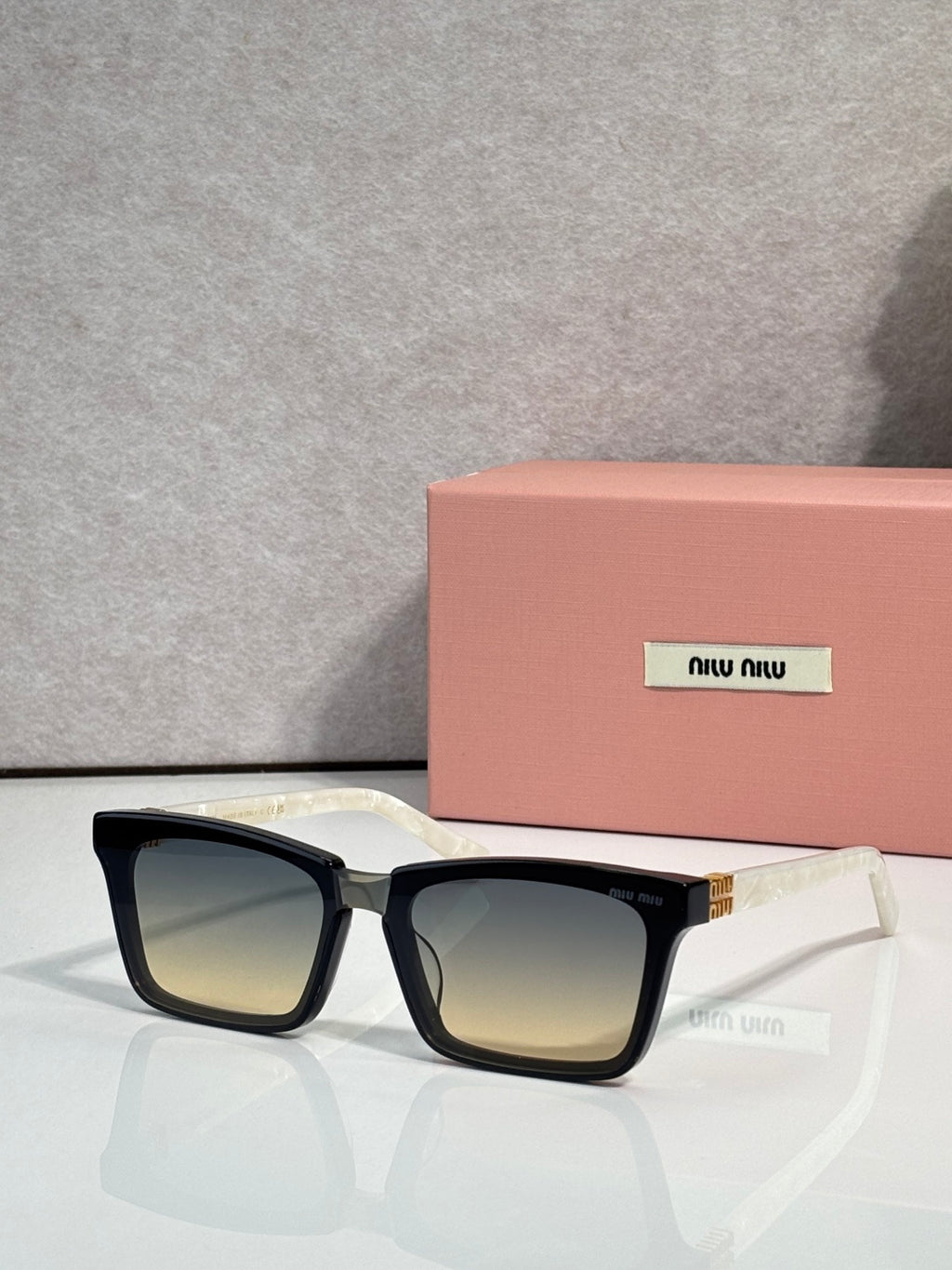 Rectangular sunglasses with black frame and gradient dark-tinted lenses