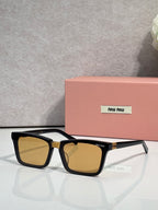 Rectangular sunglasses with black frame and amber-tinted lenses, miu miu logo