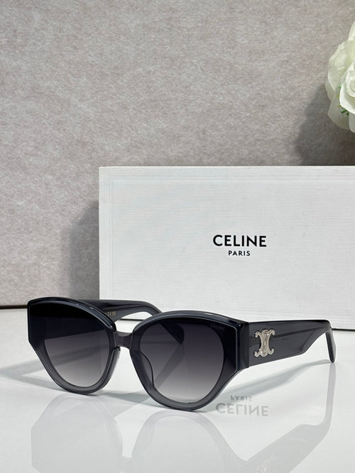 Celine sunglasses with glossy black frames, gold Celine logo on temple, dark lenses.