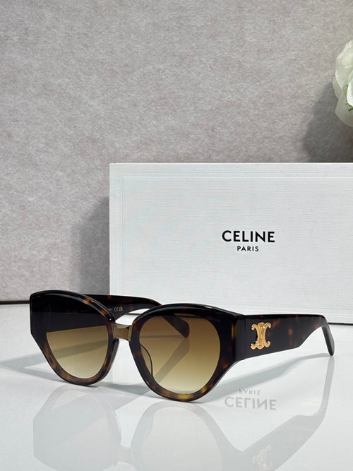 Celine sunglasses with black tortoiseshell frames, gold logo detail, tinted lenses.