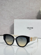 Celine sunglasses with black frames, lighter amber lenses, gold logo on temple.