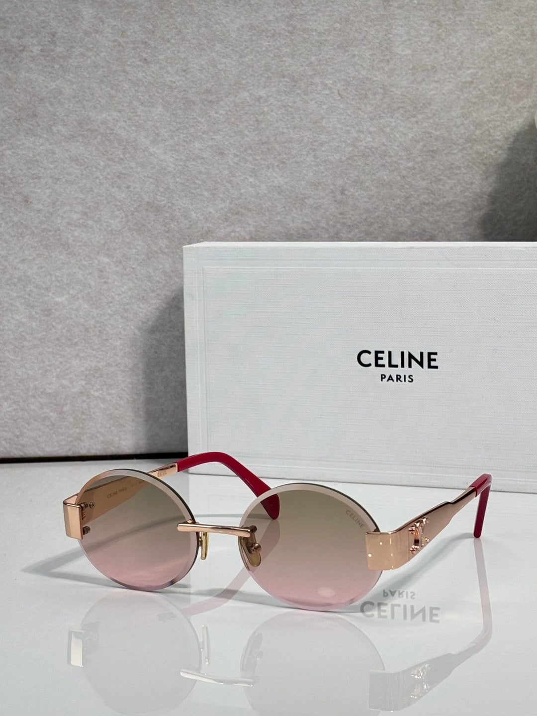 Celine sunglasses with round light pink-tinted lenses and tortoise-pattern frame