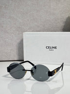 Celine sunglasses with round dark lenses and black frame, gold-tone hinge details