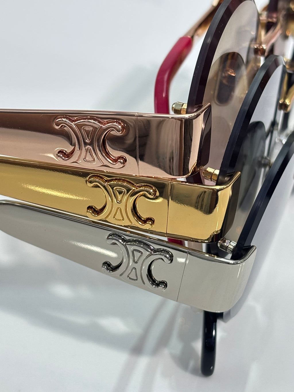 Celine sunglasses metal temple close-up with gold-tone engraving and dark frame accents