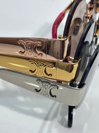 Celine sunglasses metal temple close-up with gold-tone engraving and dark frame accents