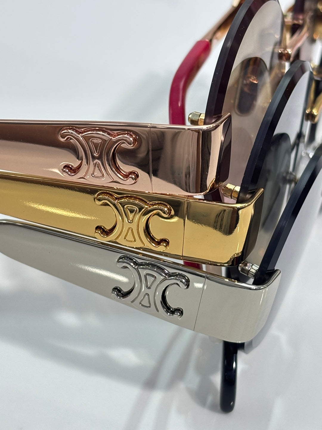 Celine sunglasses metal temple close-up with gold-tone engraving and dark frame accents