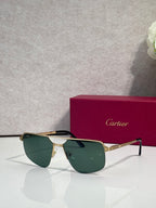 Sunglasses with gold metal frame and dark green mirrored lenses, cat-eye style