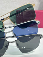 Sunglasses close-up stack with gold and dark frames and mirrored blue lenses