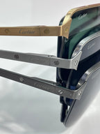 Cartier eyeglass temples close-up with engraved logos on metal arms