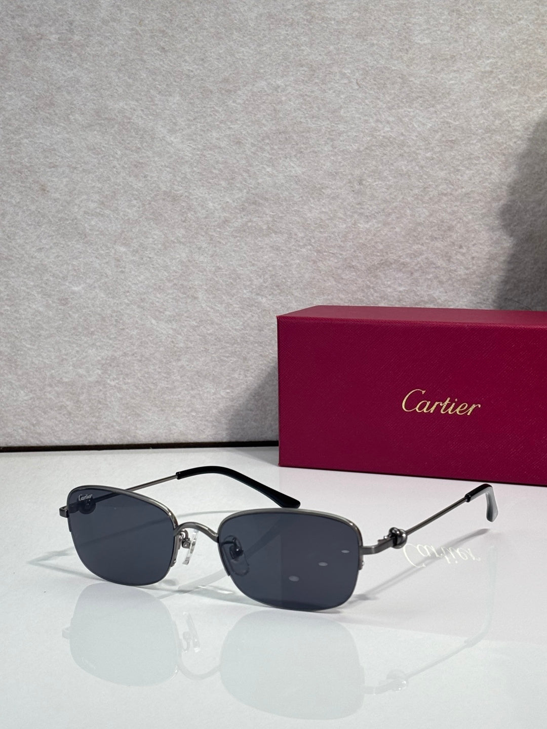 Cartier sunglasses with dark lenses and black-and-silver metal frame