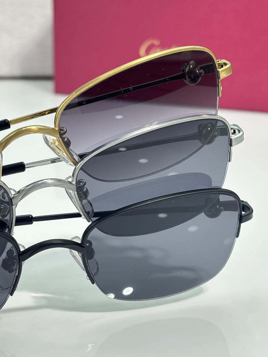 Cartier sunglasses with stacked oval frames and dark lenses, two-tone metal