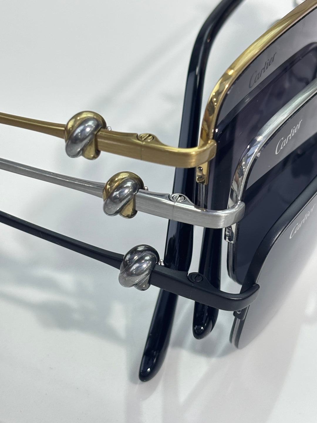 Cartier eyeglass hinges and metal temples with dark blue lens rims