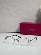 Cartier glasses with clear lenses, silver metal frame and dark arms