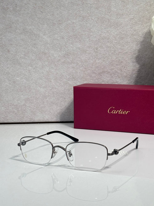 Cartier glasses with clear lenses, silver metal frame and dark arms