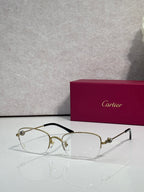 Cartier glasses with clear lenses, gold metal frame and dark arms