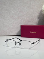 Cartier glasses with clear lenses, black metal frame and dark temples