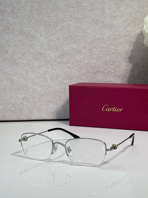 Cartier glasses with clear lenses, silver frame and black top bar