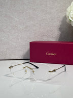 Black eyeglasses with clear lenses and gold-tone details, thin frame with round shape