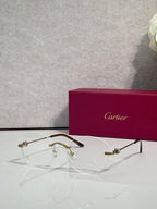 Gold eyeglasses with clear lenses and gold-tone bridge, round rectangular frame