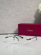 Black eyeglasses with clear lenses and metal details, thin frame with round shape