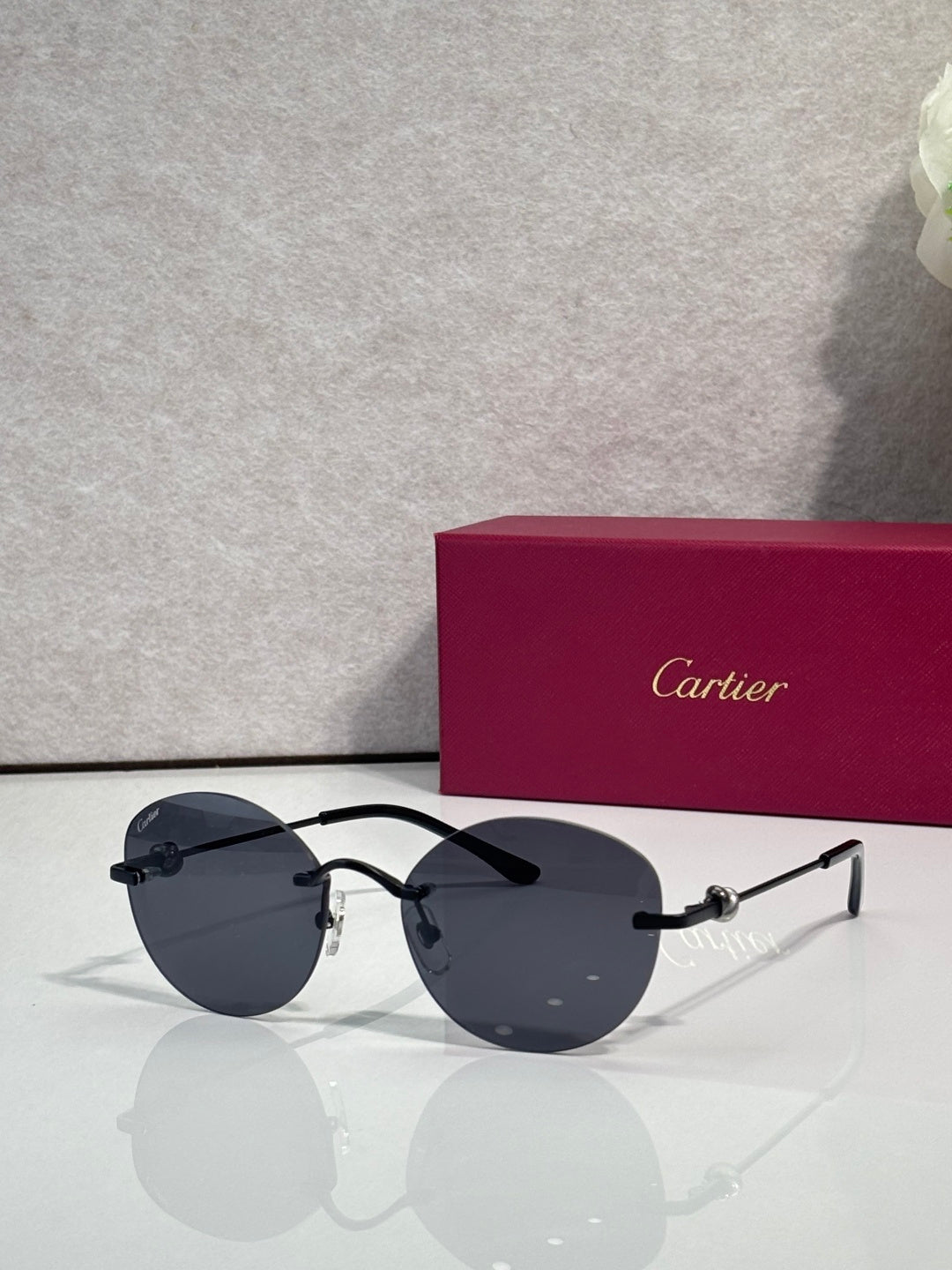 Cartier round sunglasses with dark lenses and silver-tone metal frames